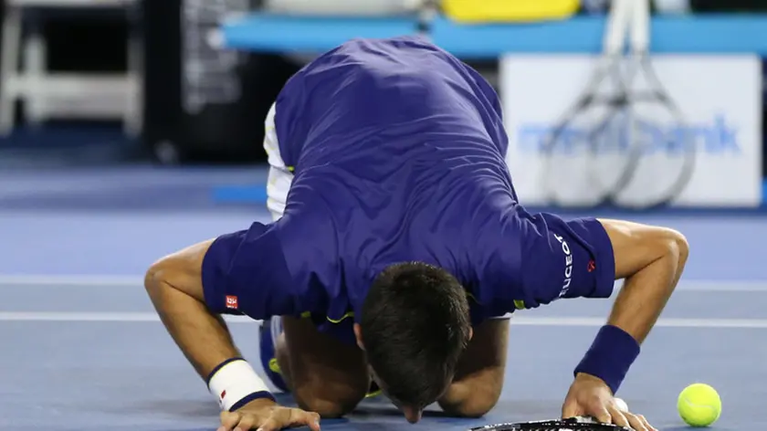 (160131) -- MELBOURNE, Jan. 31, 2016 (Xinhua) -- Novak Djokovic of Serbia celebrates after winning the final of men's singles against Andy Murray of Great Britain at the Australian Open Tennis Championships in Melbourne, Australia, Jan. 31, 2016. Novak Djokovic won the match 6-1, 7-5, 7-6. (Xinhua/Xu Yanyan)