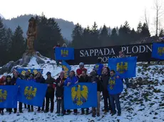 Local citizens with flags of arms of the Friuli Venezia Giulia Region celebrate after the decision of the Italian Lower House that approved the law proposal for moving the Veneto region border town of Sappada juridically to the neighbouring Friuli Venezia Giulia region in Sappada, northern Italy, 22 November 2017. Friuli Venezia Giulia region is one of five Italian regions with special status with more autonomy from the general government. ANSA/FRANCESCO FONTANA HOFFER