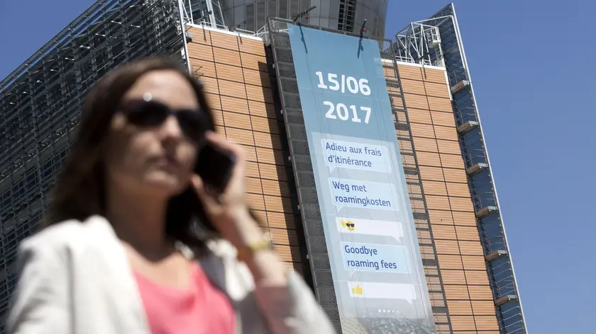 epa06027793 A giant placard on European commission headquarters announces the end of mobile phone roaming fees in Brussels, Belgium, 14 June 2017. Mobile roaming charges across the EU are to finally end the latest on 15 June 2017. EPA/OLIVIER HOSLET