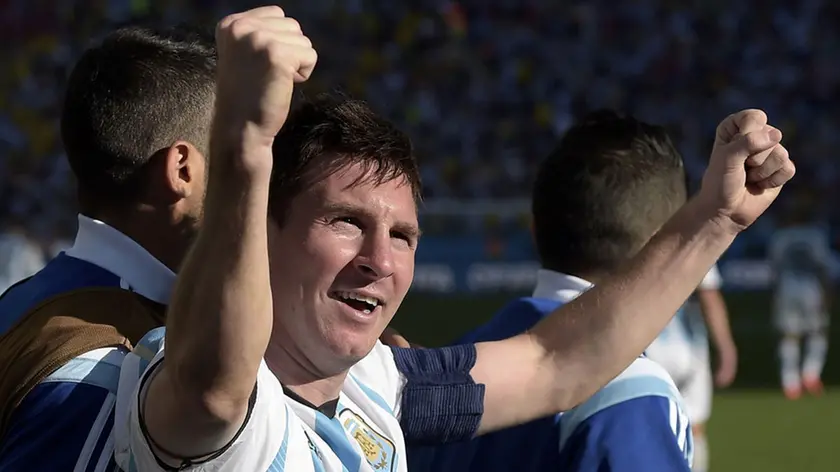 Argentina's Lionel Messi celebrates after Angel di Maria scored his side's only and winning goal in extra time during the World Cup round of 16 soccer match between Argentina and Switzerland at the Itaquerao Stadium in Sao Paulo, Brazil, Tuesday, July 1, 2014. Argentina defeated Switzerland 1-0 to move on to the quarterfinals. (AP Photo/Manu Fernandez)