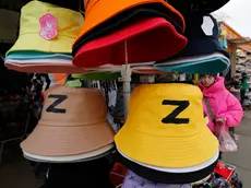 epa09926485 Hats featuring the letter 'Z' on display at the Apraksin market in central St. Petersburg, Russia, 04 May 2022. On 24 February 2022, Russian troops had entered Ukrainian territory in what the Russian president declared a 'special military operation', resulting in fighting and destruction in the country, a huge flow of refugees, and multiple sanctions against Russia. EPA/ANATOLY MALTSEV