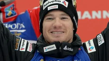 Dario Cologna of Switzerland celebrates as he wins the Men's 2 x 15 km Cross Country Skiathlon competition at the FIS Nordic Skiing World Championships 2013 in Tesero, Italy, 23 February 2013. ANSA/CLAUDIO ONORATI
