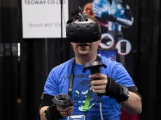 epa08106937 A visitor tries Tegway's thermoelectric gloves during the CES Unveiled Las Vegas at the 2020 International Consumer Electronics Show in Las Vegas, Nevada, USA, 05 January 2020. The annual CES which takes place from 7-10 January is a place where industry manufacturers, advertisers and tech-minded consumers converge to get a taste of new innovations coming to the market each year. EPA/ETIENNE LAURENT