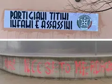 In alto lo striscione di CasaPound affisso sulla parete della Casa della cultura slovena a Opicina. Cartelloni simili sono comparsi in tutta Italia. Sotto la scritta a Basovizza che offende Norma Cossetto. Foto Lasorte