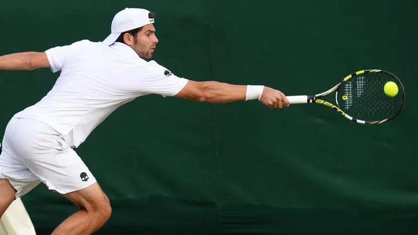 epa04287944 Simone Bolelli returns to Kei Nishikori of Japan during their third round match of the Wimbledon Championships at the All England Lawn Tennis Club, in London, Britain, 28 June 2014. EPA/ANDY RAIN