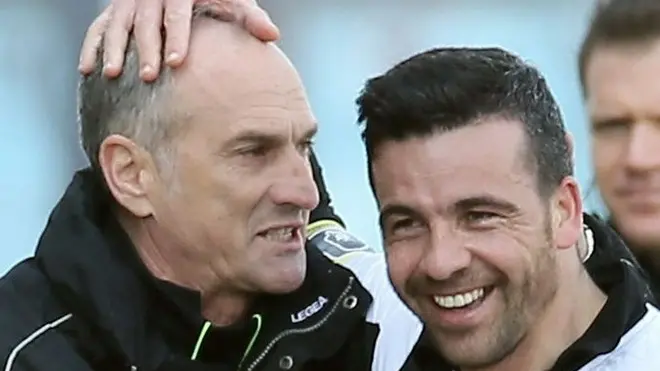Udinese's Antonio Di Natale, right,, celebrates with coach Francesco Guidolin, after scoring during the Serie A soccer match between Udinese and Chievo, at the Friuli Stadium in Udine, Italy, Sunday, April 07, 2013. (AP Photo/Paolo Giovannini)