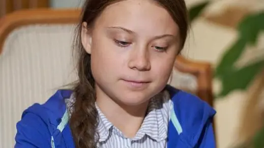 epa07875339 Swedish climate activist Greta Thunberg signs the guest book after receiving the key to the city from the Mayor of Montreal Valerie Plante (not pictured) following the climate strike in Montreal, Quebec, Canada, 27 September 2019. Thunberg participated in several climate events in Montreal, continuing a month-long series of climate-related appearances in the US and Canada which began with her sailing from England to New York in late August. EPA/VALERIE BLUM