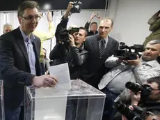 Serbian Progressive Party leader Aleksandar Vucic casts his ballot at a polling station in Belgrade, Serbia, Sunday, March 16, 2014. Serbs are voting in an early parliamentary election that is expected to tighten the grip on power of the ruling populists, who have become popular by promising to fight crime and corruption in the troubled Balkan nation seeking EU entry. (AP Photo/Darko Vojinovic)