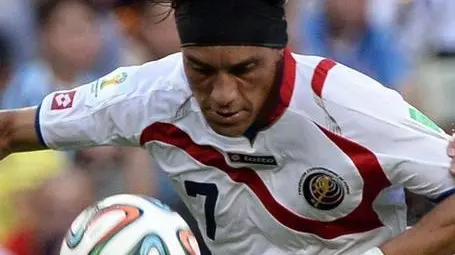 epa04257094 Costa Rica's Christian Bolanos (L) and Uruguay's Maxi Pereira (R) vie for the ball during the FIFA World Cup 2014 group D preliminary round match between Uruguay and Costa Rica at the Estadio Castelao in Fortaleza, Brazil, 14 June 2014. (RESTRICTIONS APPLY: Editorial Use Only, not used in association with any commercial entity - Images must not be used in any form of alert service or push service of any kind including via mobile alert services, downloads to mobile devices or MMS messaging - Images must appear as still images and must not emulate match action video footage - No alteration is made to, and no text or image is superimposed over, any published image which: (a) intentionally obscures or removes a sponsor identification image; or (b) adds or overlays the commercial identification of any third party which is not officially associated with the FIFA World Cup) EPA/GEORGI LICOVSKI EDITORIAL USE ONLY