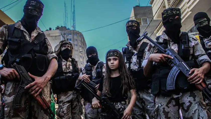 29 Aug 2014, Gaza, Gaza Strip --- Children taking part in the military parade, which was organized by Al-Quds Brigades, the armed wing of Islamic Jihad, marking the end of the war on Gaza and what they called a victory over Israel. (Photo by Ibrahim Khader / Pacific Press) --- Image by © Pacific Press/Corbis