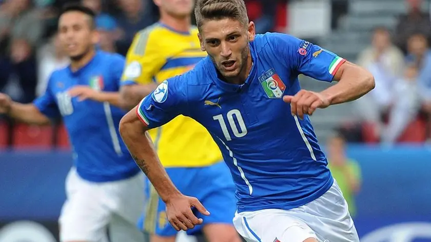 epa04806862 Domenico Berardi of Italy celebrates scoring the opening goal during UEFA European Under-21 Championship match Italy vs Sweden at the Ander Stadium, Olomouc, Czech Republic, 18 June 2015. EPA/PETER POWELL .