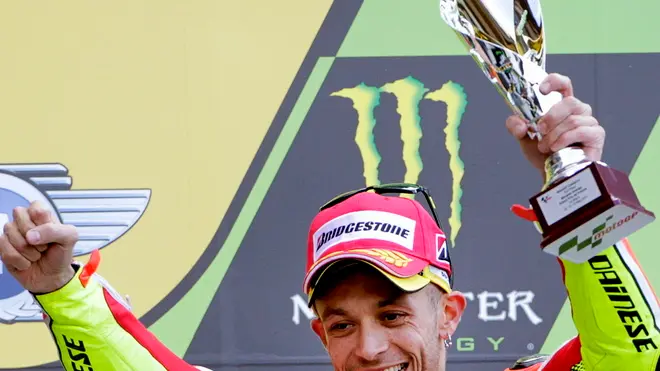 15 May 2011, Le Mans, France --- epa02734778 Italian MotoGP rider Valentino Rossi of the Ducati Team celebrates on the podium after placing third in the Motorcycling Grand Prix of France in Le Mans, France, 15 May 2011. Rossi celebrated his first podium with new team Ducati. EPA/SALVATORE DI NOLFI --- Image by © SALVATORE DI NOLFI/epa/Corbis