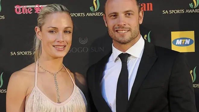 epa03584778 A picture made available on 15 February 2013 shows South African paralympic and Olympic sprinter, Oscar Pistorius (R) posing with his girlfriend, model Reeva Steenkamp (L) at the South African sports awards ceremony in Johannesburg 04 November 2012. Pistorius was arrested for the fatal shooting of his girlfriend Reeva Steenkamp at his Pretoria home in South Africa 14 February 2013. The circumstances around the shooting are still unclear. He will make an appearance in Pretoria court 15 February 2013. EPA/FRENNIE SHIVAMBU