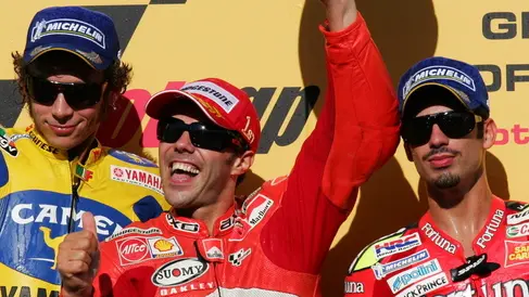 24 Sep 2006, Motegi, Japan --- Moto GP rider Loris Capirossi (C) of Italy celebrates his victory on the podium with second Valentino Rossi (L) and third Marco Melandri (R) in the motorcycling Moto GP Grand Prix of Japan at motegi circuit north of Tokyo. --- Image by © Katsuji Fujii/epa/Corbis