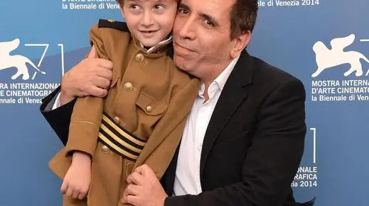 Iranian film director Mohsen Makhmalbaf and Georgian actor/cast member Dachi Orvelashvili (L) pose during a photocall for the movie 'The President', during the 71th annual Venice Film Festival at the Lido in Venice, Italy, 27 August 2014. The movie is presented in the Orizzonti section at the festival that runs from 27 August to 06 September. ANSA/ETTORE FERRARI