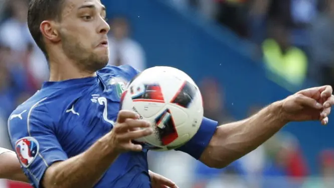 Spain midfielder David Silva (L) fights for the ball with Italy midfielder De Sciglio during the Euro2016 round of 16 soccer match between Italy and Spain at Stadium de Saint-Denis in Paris, France, 27 June 2016. For editorial news reporting purposes only. Not used for commercial or marketing purposes without prior written approval of UEFA. Images must appear as still images and must not emulate match action video footage. Photographs published in online publications (whether via the Internet or otherwise) shall have an interval of at least 20 seconds between the posting.) EFE/Kai Forsterling