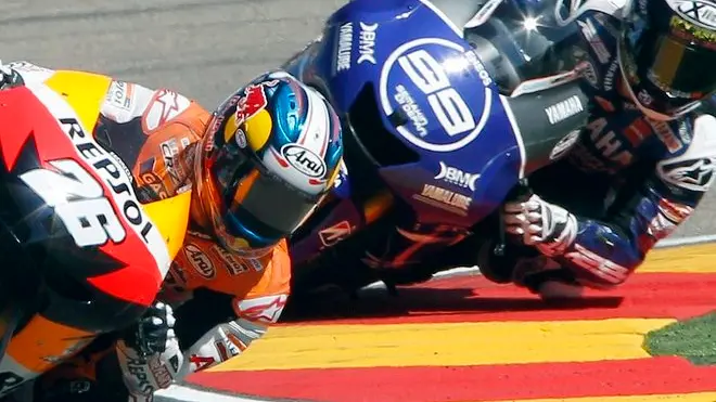30 Sep 2012, Alcañiz, Spain --- epa03415893 Spanish MotoGP rider of Repsol Honda team Dani Pedrosa (L) takes a bend followed by Spanish of Yamaha team Jorge Lorenzo (R) during the Aragon Grand Prix held at Motorland racetrack in Alcaniz, Aragon, northern Spain, on 30 September 2012. EPA/ANDREU DALMAU --- Image by © ANDREU DALMAU/epa/Corbis