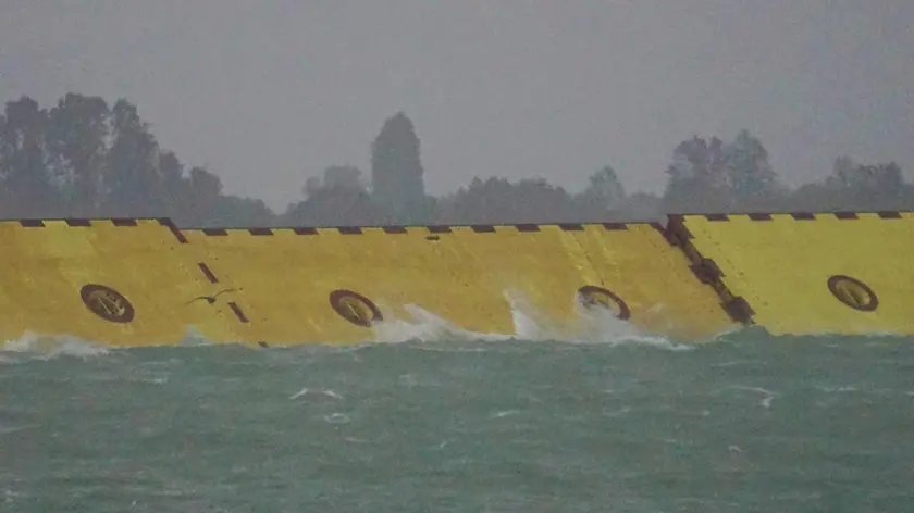 The barriers of the 'Mose', emerged from the water, for the first time, to protect Venice from the high tide, for now still under the metro, Venice, Italy, 03 October 2020. On Venice has begun to rain, and there is a strong sirocco wind. ANSA / Andrea Merola