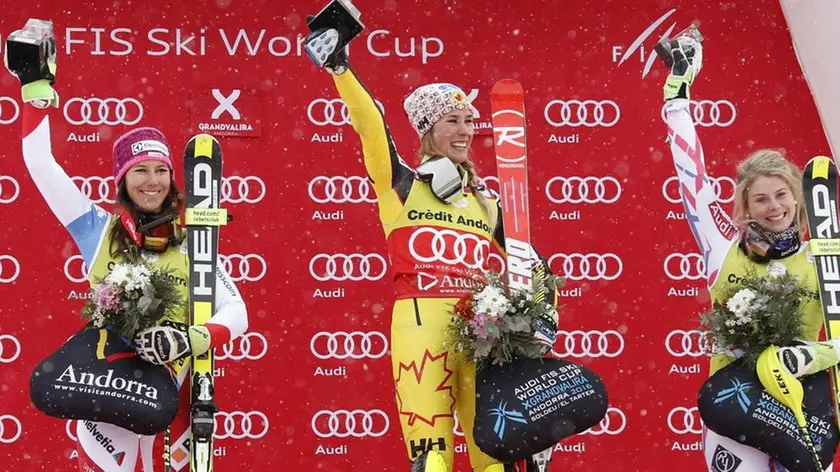 epa05185137 (L-R) Second placed Wendy Holdener of Switzerland, winner Marie-Michele Gagnon of Canada and third place Anne-Sophie Barthet of France celebrate on the winner podium after the FIS Alpine Skiing World Cup in Soldeu-El Tarter, Andorra, 28 February 2016. EPA/GUILLAUME HORCAJUELO