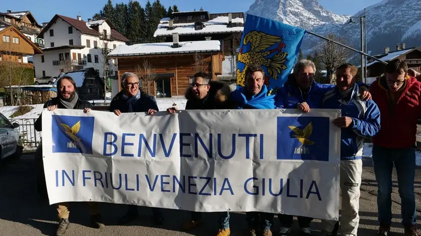 Local citizens with flags of arms of the Friuli Venezia Giulia Region celebrate after the decision of the Italian Lower House that approved the law proposal for moving the Veneto region border town of Sappada juridically to the neighbouring Friuli Venezia Giulia region in Sappada, northern Italy, 22 November 2017. Friuli Venezia Giulia region is one of five Italian regions with special status with more autonomy from the general government. ANSA/FRANCESCO FONTANA HOFFER