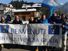 Local citizens with flags of arms of the Friuli Venezia Giulia Region celebrate after the decision of the Italian Lower House that approved the law proposal for moving the Veneto region border town of Sappada juridically to the neighbouring Friuli Venezia Giulia region in Sappada, northern Italy, 22 November 2017. Friuli Venezia Giulia region is one of five Italian regions with special status with more autonomy from the general government. ANSA/FRANCESCO FONTANA HOFFER