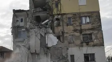 In this Wednesday, Nov. 27, 2019 photo, dust rises from the falling parts of a destroyed building during an aftershock in Thumane, western Albania. The 6.4-magnitude quake that hit Albania's Adriatic coast before dawn on Tuesday has left at least 51 people dead, around 2,000 others injured and about 4,000 people homeless. (ANSA/AP Photo/Petros Giannakouris) [CopyrightNotice: Copyright 2019 The Associated Press. All rights reserved]