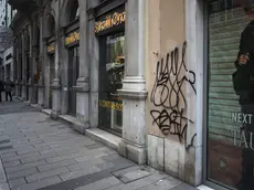 Le scritte dei vandali in via San Nicolò