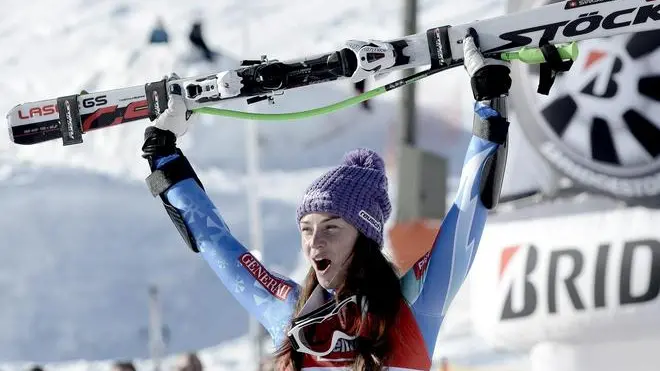 epa03533378 Tina Maze of Sloveia celebrates on the podium after winning the Women's Super-G race of the Alpine Skiing World Cup in St. Anton, Austria, 13 January 2013. EPA/HANS KLAUS TECHT