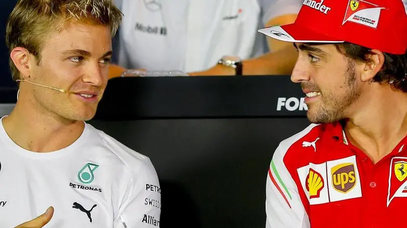 epa04384110 German Formula One driver Nico Rosberg (L) of Mercedes AMG GP and Spanish Formula One driver Fernando Alonso (R) of Scuderia Ferrari during a press conference at the Formula One circuit in Monza, Italy, 04 September 2014. The 2014 Formula One Grand Prix of Italy will take place on 07 September 2014. EPA/SRDJAN SUKI