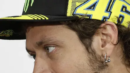 MotoGP rider Valentino Rossi of Italy, right, talks with Stefan Bradl of Germany during a press conference at the Termas de Rio Hondo circuit in Argentina, Thursday, April 24, 2014. Argentina's Motorcycle Grand Prix will take place Sunday. (AP Photo/Natacha Pisarenko)