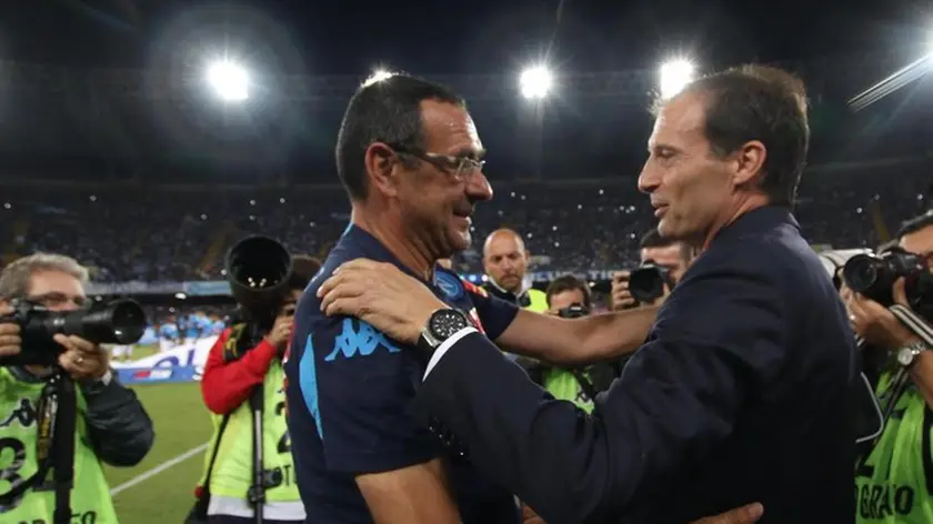 Italian head coach of SSC Napoli Murizio Sarri (L) greets Italian head coach of FC Juventus Massimiliano Allegri during their Italian Serie A soccer match at San Paolo Stadium in Naples, 26 September 2015. ANSA/CESARE ABBATE