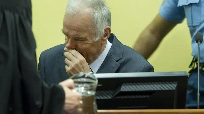 epa03220775 Former Bosnian Serb general Ratko Mladic (C) sits in the courtroom during his trial at the International Criminal Tribunal for the former Yugoslavia (ICTY) in The Hague, the Netherlands, 16 May 2012. Mladic has been charged with 11 counts of genocide and other war crimes committed by the Serb army he commanded during the 1992-95 Bosnian war against Muslims and ethnic Croats. The most notable of the atrocities was the 1995 Srebrenica massacre of nearly 8,0000 Muslims and the 40-month siege of Sarajevo, in which more than 11,000 people were killed. EPA/TOUSSAINT KLUITERS / POOL