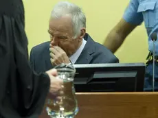 epa03220775 Former Bosnian Serb general Ratko Mladic (C) sits in the courtroom during his trial at the International Criminal Tribunal for the former Yugoslavia (ICTY) in The Hague, the Netherlands, 16 May 2012. Mladic has been charged with 11 counts of genocide and other war crimes committed by the Serb army he commanded during the 1992-95 Bosnian war against Muslims and ethnic Croats. The most notable of the atrocities was the 1995 Srebrenica massacre of nearly 8,0000 Muslims and the 40-month siege of Sarajevo, in which more than 11,000 people were killed. EPA/TOUSSAINT KLUITERS / POOL