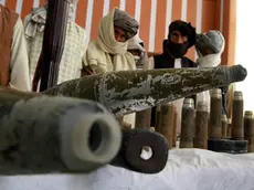 epa03760536 Former Taliban militants attend a ceremony during which they surrender arms under a US-backed Afghan government amnesty program, in Kushki Kuhna district of Herat, Afghanistan, 26 June 2013. Reports state that seventeen militants laid down their arms in Mazar-e-Sharif on 26 June. Under an amnesty program launched by President Hamid Karzai in November 2004, hundreds of anti-government militants have so far surrendered to the government. Taliban-led militants have been waging a bloody war against Afghan and NATO forces for a decade, often infiltrating Afghan security forces and carrying out deadly attacks on NATO and Afghan forces. EPA/JALIL REZAYEE