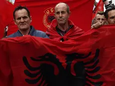 epa03645218 Kosovar Albanians shout slogans and hold Albanian national flags during a protest in southern part of the ethnically divided town of Mitrovica, Kosovo, 30 March 2013. Reports state that a few thousand Kosovar Albanians gather to protest against talks between Kosovo's and Serbia's Prime Ministers to be held in Brussels on 02 April 2013. The key sticking point in the negotiations, which began in October, has been the degree of autonomy that should be granted to Serbian-dominated municipalities in the north of Kosovo. EPA/VALDRIN XHEMAJ