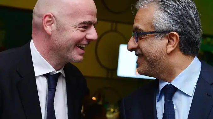 epa05145307 FIFA Presidential candidates Gianni Infantino (L) and Shaikh Salman Al Khalifa during the CAF LOC Dinner at the Serena Hotel in Kigali, Rwanda, 05 February 2016. EPA/GAVIN BARKER UK AND IRELAND OUT