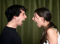 Couple yelling face to face --- Image by © John Rensten/Corbis