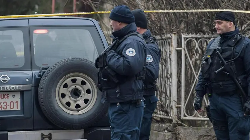 epa06443277 Police guards at the sealed-off crime scene where Oliver Ivanovic, the former State Secretary for Kosovo and Metohija and a subject of a controversial war crimes trial and retrial, was shot in Mitrovica, Serbia, 16 January 2018. The prominent Ivanovic was shot in front of his office in Mitrovica, Kosovo, 16 January 2018, according to media reports. EPA/STRINGER