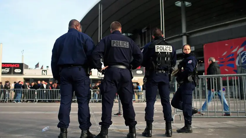 French riot police officers stand guard outside the Stade de France in Saint Denis, north of Paris, Saturday, Feb. 6, 2016. (ANSA/AP Photo/Thibault Camus)