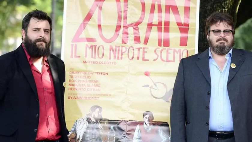 Italian director Matteo Oleotto (L) and actor/cast member Giuseppe Battiston pose for photographs during the photocall for the movie 'Zoran, il mio nipote scemo' (Zoran, my nephew the idiot), in Rome, Italy, 28 October 2013. The movie will be released in Italian cinemas on 31 Ocyober. ANSA/CLAUDIO ONORATI.