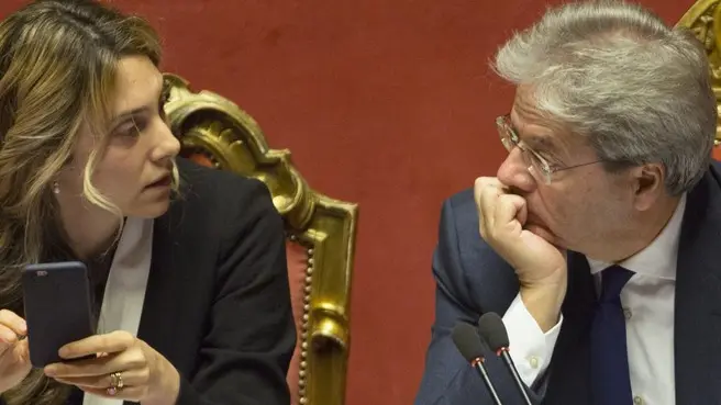 ROME, ITALY, DECEMBER 14: Italian Prime Minister Paolo Gentiloni (R) listens to Public Administration and Simplification Minister Marianna Madia (L) during a plenary session at the Senate, before a vote of confidence, in Rome, Italy, on December 14, 2016. Riccardo De Luca / Anadolu Agency