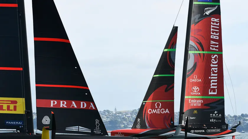 Italy's Luna Rossa, left, sails off their foils against Emirates Team New Zealand in race eight of the America's Cup on Auckland's Waitemata Harbour, Monday, March 15, 2021. (Chris Cameron/Photosport via AP)